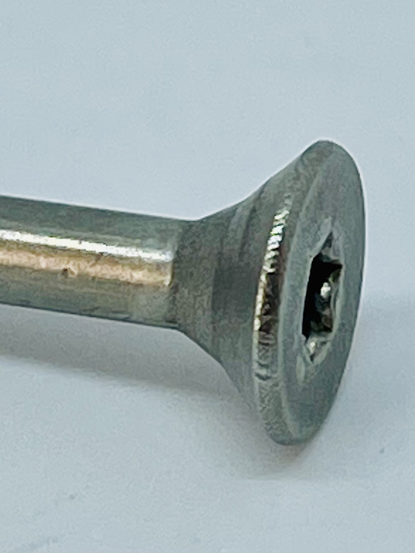 Reinforced head-to-shank transition